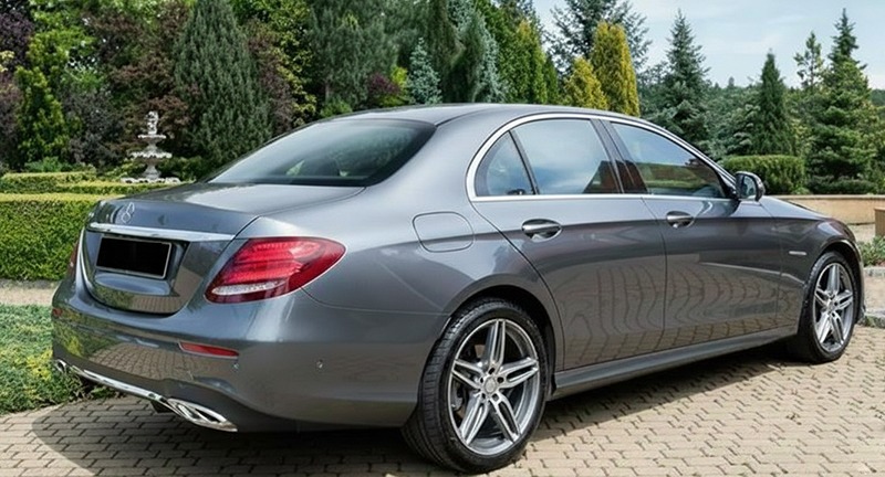 Gray Mercedes-Benz E-Class, rear three-quarter view