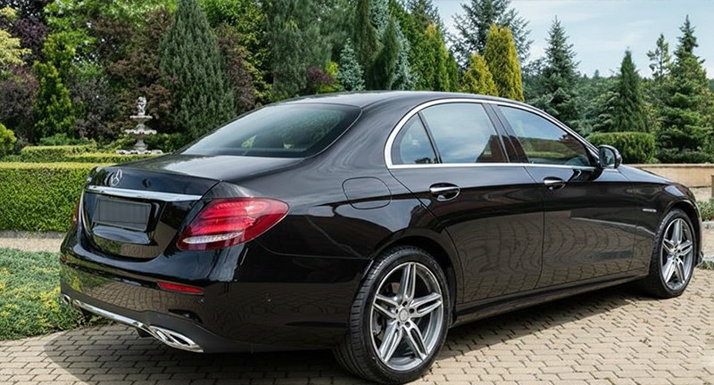 Black Mercedes-Benz E-Class, rear three-quarter view